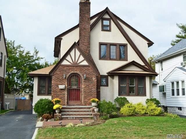 Charming 3Br Tudor Colonial, 2 Full Bths, Living Room W/ Fireplace, Large Formal Dining Room, Den Or Office, Eik, Hardwood Floors Throughout, Central Air, Full Walk Up Attic/Excellent Bonus Space, Full Basement. Move In Condition, Walk Few Short Blocks To Lirr, Schools And Shops. This Home Will Not Last!