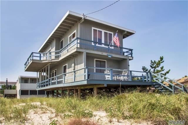 Spectacular Oversized Beach House In Kismet With 4 Bedrooms And 2 Full Baths. Open Living Concept With Exceptional Water Views Of The Atlantic Ocean. Has A Wrap Around Deck On 1st Floor With Outdoor Shower, And A Second Story Balcony To Watch The Surf From The Morning To Night. A Must See!