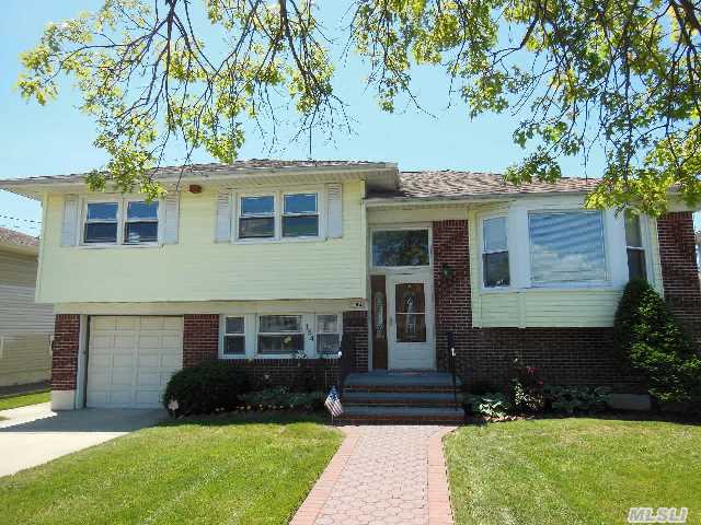 Hugh 4 Level Barnum Island Split Great Layout And An Open Feel Throughout This Home. Big Bdrms And Basement And Huge Manicured  Yard. New Lower Level Den .5 Bath And Heating System. Close To T Of H Shell Creek Park Lirr And Lincoln Orens Middle School. Make This Beauty Your New Home.