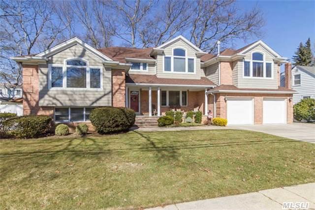 Beautifully Expanded Up & Out In 2003. This Split Features A Unique Layout Including Large Eik W/Granite Counter Tops & S/S Applcs, Oversized Fdr, Great Rm W/Wet Bar & Gas Fplc, Mstr Br Ste W/Mstr Bth & Wic. All Lg Bdrms,  Gleaming H/W Flrs, Crown Moldings, 5 Zone Ht Incl: H/W, Radiant & H/A. 2 Zone Cac. Wired For Sound, Plenty Of Storage, Lovely Entertainment Yard.