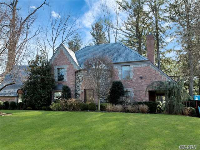 Pristinely Renovated French Normandy Tudor Boasts Traditional Accents, Sleek Vermont Slate Roof, Majestic Turret. Elegant Formal Rooms, Sprawling Open-Plan Kitchen, Breakfast Area Opens To A Masterfully Designed Covered Porch, Four Bedrooms, 2.5 Luxurious Baths, Finished Lower Level, Beautiful Millwork Provides Character To The Layout And Design.