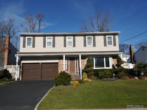 Spectacular 4 Bdrm Center Hall Colonial W Grand Entry Foyer Located In Prime 'Bethpage Estates'.This Impressive Home Offers Great Curb Appeal-A Fab Private Backyrd W Ingrnd Pool-Pavers-Pvc-2 Car Gar.Spacious Layout Has Sunken Fam Rm W Fplc-Banquet Sized Dining Rm-Huge Mstr Suite W Mstr Bth-O/S Rms-Clsts Galore.New Roof-Updtd Wndws&Sdng-200Amps-Hdwd Flrs-Skylites-Hihats-Igs