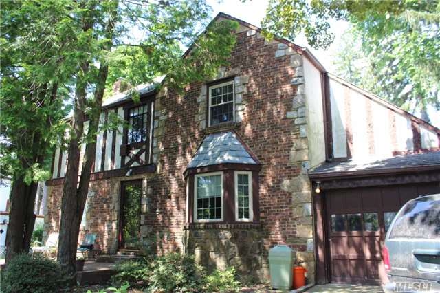 Brick And Stucco Tudor With Slate Roof. Home Sits On A Quiet & Tranquil Residential Street. Formal Living Room /Wood Burning Fireplace , Dining Room With Half Bath And Attached Garage Second Floor Features Master Bedroom With Master Bath And Two Additional Bedrooms Along With An Additional Full Bathroom. Saddle Rock Elementary Great Neck North