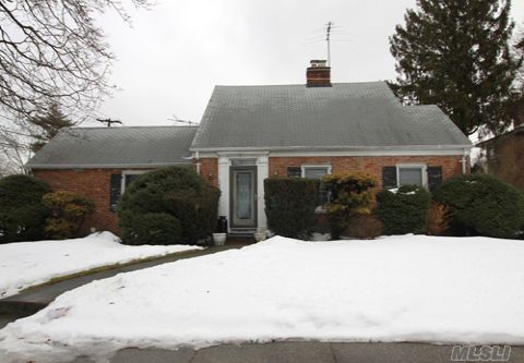Beautiful Expanded Cape. Corner Property, Extended With Attached Garage. House Features Dining Room, Kitchen, 4 Bedrooms, 2 Full Baths, Large Finished Basement,And 2 Fire Places. Park Across The Street. Close To Lirr And Schools.