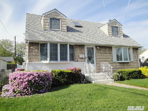 Mid-Block ,Well-Maintained Expanded And Dormered Cape With A Full Basement,5 Bedrooms ,2 Baths,Banquet Size Kitchen With Gas Cooking,1.75 Detached Garage Many Updates.Super Clean !!!