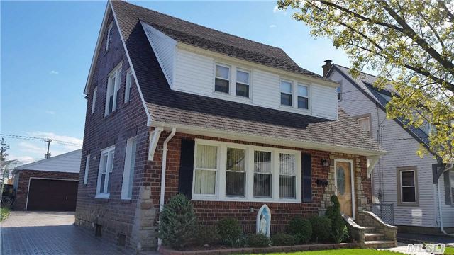 Lovely All Brick Colonial In The Herricks School District. Beautiful Hardwood Floors Throughout, New Baths, Windows, Roof. Interlocking Walkway, Driveway And Backyard, 2 Car Garage. Close To All, Won't Last. Turn Key.