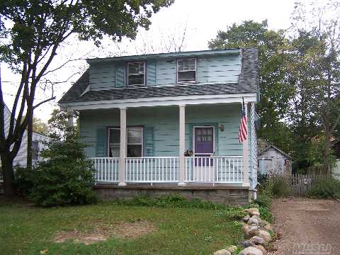 1913 Vintage Dutch Colonial Featuring New Roof, Updated Eik, Den/Bedroom, Formal Dining Rm, Living Rm, Full Bath, Hardwood Floors Throughout, Upstairs Includes 2 Bedrooms & 1 Full Bath.