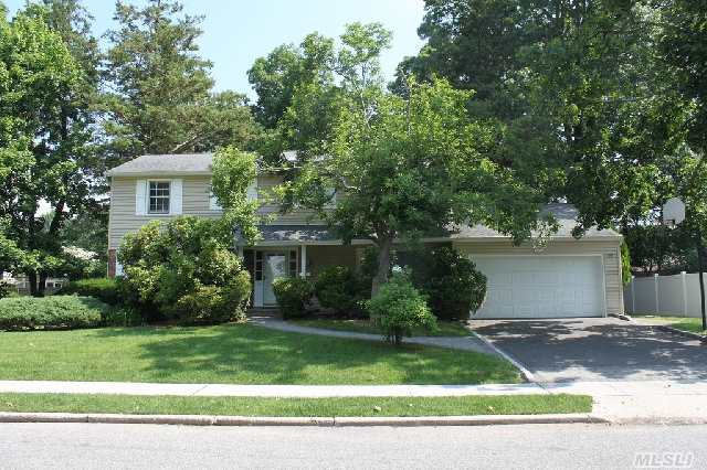 Colonial In Perfect East Birchwood Location Featuring 4 Bedrooms,  2.5 Bathrooms,  Eat-In-Kitchen With Gas Cooking,  Landscaped Backyard With A Large Wooden Deck,  Central A/C,  Full Basement,  2 Car Garage,  Jericho Schools.