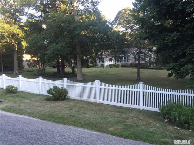 Partially Fenced Yard With Sprawling Lawn And Beautiful Trees, Paved Driveway