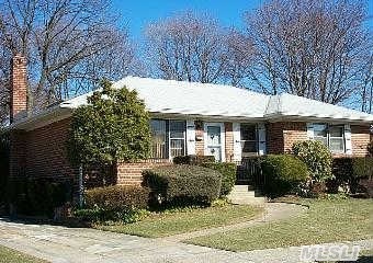 One Of A Kind Expanded And Extended Brick Ranch Features All Oversized Rooms-3 Bedrooms Including King Master With Full Bath And Walk In Closet-All On Oversized Property-Very Quiet Residential Street Is A Diamond In The Rough-Banquet Size Formal Dining Room  Sliders To Deck-Just Awaits Your Updates And Your Furniture-Updated Boiler