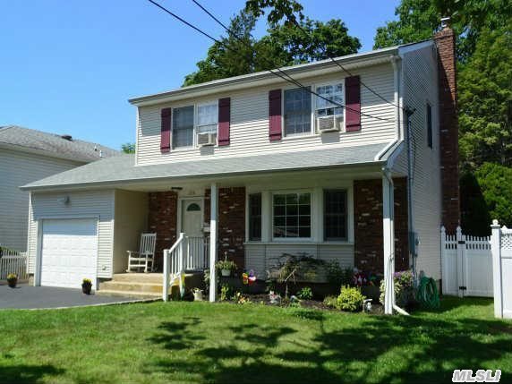 Beautiful,  Lge Colonial With 3 O/S Bedrooms, Great Curb Appeal, New Vinyl Siding, 8 Year Roof, New Oak Eik Kit W  Corian Counters, Brand New S/S Applcs, Moen Sink With  Water Filtration System, New 6 Ft Pvc Fence All Around, 5 Zone Sprinkler System, New Fin Bsmt, W/Slop Sink, And Plumbed For Bathroom, New Gas Water Heater, 3  Zone Heat.New Roof.Near Pky, Walk To Rr And Quaint Village