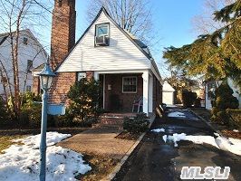 Tudor Looking 4 Br,2 Bth Cape W/Slate Roof,Hardwood Flrs,Wood Burning Fp,Fin Bsmt,Lr,Dining Area,Sliders To Wood Deck,Det Garage,Indoor Oil Tank.