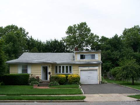 'Got Kids?'this Home Backs 'Suburban Park' W/Swing Sets-Basketball Court-Baseball Field & Lots Of Room To Play!(Watch The Kids From Your Own Backyard)Great 8 Room Ranch In Affordable Syosset Neighborhood.1 Of 4 Homes Available On This Block.This One Needs Updating But Offers Lower Taxes,An Additional Family Room,1 More Bedroom,Hardwood Floors & 1 Car Garage.Run-Don't Walk!