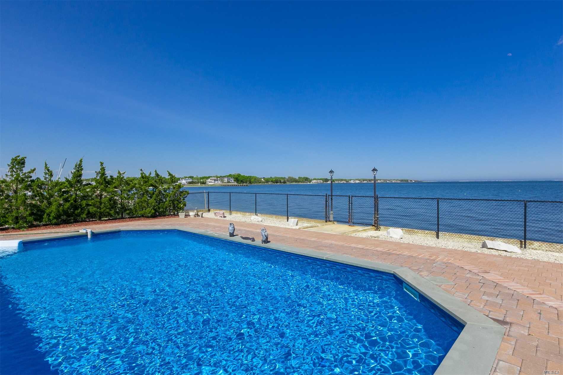 Incredible Bayfront Home With Amazing Waterviews Features: Great Room With Floor To Ceiling Windows & Fireplace, Eik W/Granite Counter Tops, Formal Liv Rm/Game Room, Master Bedroom Suite W/Walk In Closet, Full Bathroom And Terrace, 3 Additional Bedrooms, 1 Car Garage. Updated Central Air Conditioning & Heating System, In Ground Pool W/Pavers, Stunning Views Of The Bay. You Don&rsquo;t Want To Miss This One!!!
