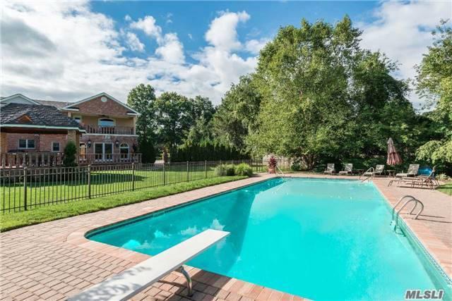 Beautiful Brick Colonial Completely Rebuilt In 2007. Flooded W/ Light, This Spacious Home Features Open Layout Kitchen/Fam Rm, Hardwood Floors Thruout, Fin Bsmt W/Sep Ose, And 4 Bedrooms On 2nd Floor Including Huge Master Suite W/3 Walk-In Closets, Bth W/Jacuzzi+Sep Shower,  Poss Mom-In-Law Suite On 1st Flr. Cul-De-Sac Location, Gas Generator & Pool!