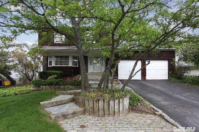 New To Market! Spacious Woodmere Colonial Highlights Oversize Master W/Dressing Area And Master Bath. Three Additional Bedrooms And Full Bath. Sunlit Formal Dining Room With Beautiful Picture Window Overlooking Yard. Large Living Room,  Plus Den W/Fireplace. Hard Wood Floors Throughout And Abundant Closets. Unfinished Basement With High Ceilings That Needs Repair.  Sd #15.