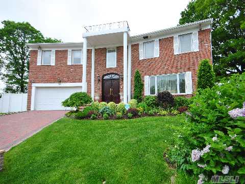 Fab Center Hall Colonial Perfectly Situated In A Quiet Cul De Sac Location.  This Home Exudes Elegance And Exquisite Sense Of Design And Style.Grand  2 Story Entry With Beautiful Stairway, Elegant And Form. Lr And Dr, A Gourmet Kitchen And Family Room With Built Ins And Fpl. Fab.2 Rm   Master Suite With A Separate Dressing Room.Everything Is Custom Designed.Herricks Sd 