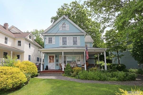 Charming 7 room Colonial in Port Washington features Eat-in- Kitchen w/Stainless Steel appliances, Formal Dining Room, Formal Living Room and Basement with fireplace plus Laundry. Large front porch with long driveway and detached 2-Car garage. Backyard for entertaining- Must See!