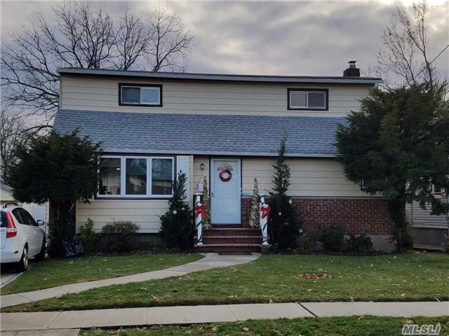 Mint Condition Expanded Cape In Elmont. 5 Bedrooms, 2 Full Baths, Full Finished Basement, Eat-In-Kitchen, Living Room, Dining Room And More.