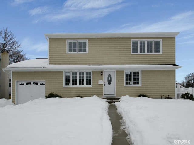 Unpack Your Bags And Move Right Into This Totally Renovated Colonial! Custom Kit W/Cherrywood Cabinets,  Granite Counters & Ss Appliances. Gleaming Hardwood Floors. New Siding,  Windows,  Boiler,   3  Full Baths And Much More! Full Finished Basement With Outside Entrance. Poss Mother Daughter W/ Proper Permits. Call Today For A Private Viewing