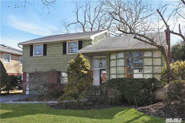 Price Reduction!! Joseph Martin Split In The Syosset School District. Features Include Large Family Room W/Bar, Powder Room, Garage & Outside Access To Patio, Formal Living & Dining Rooms, Eat-In-Kitchen W/Sliders To Large Deck, Master Br W/Access To Updated Hallway Full Bath, Plus Additional 2 Br's.