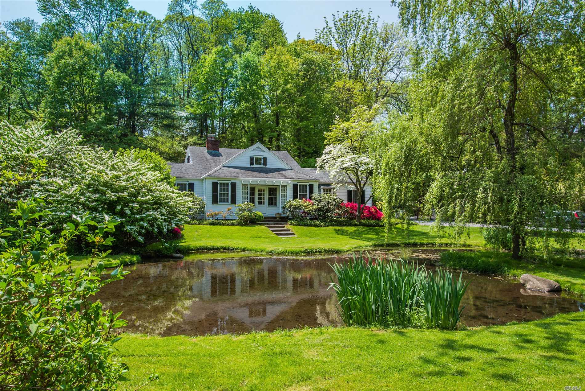 Pristine And Fully Renovated Home On 2.5 Acres Overlooking A Pond And Stream. The Home Features 3 Bedrooms And 2.5 Baths, Eik With Top Of The Line Appliances, Living Room With Fireplace, Sunroom And Library. In-Ground Pool And Terrace Can Be Accessed From The Sun Room And Master. Large Field Lies Beyond.