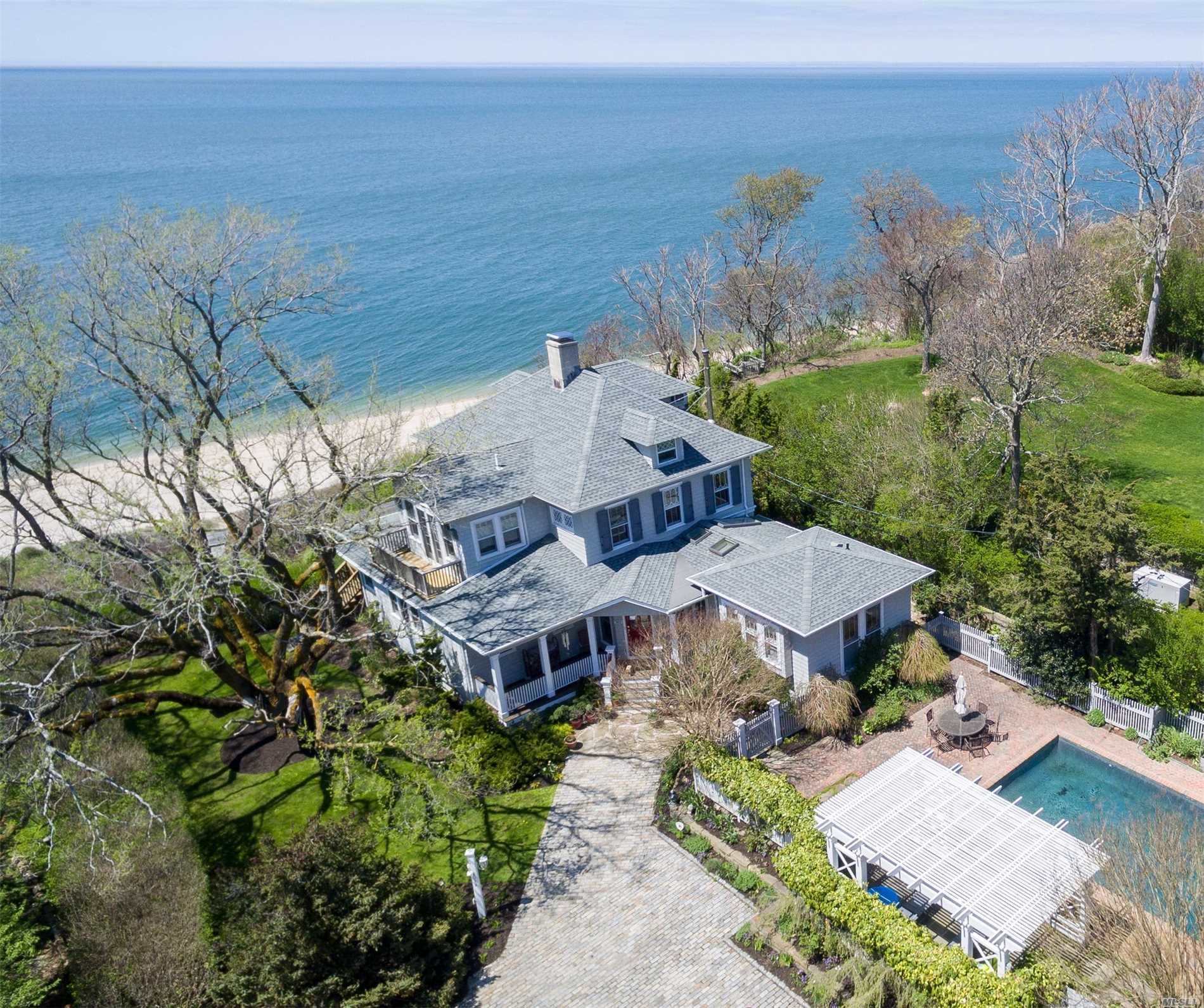 Exquisitely restored mint antique home overlooking LI Sound. Panoramic water views from many rooms, waterside patio, waterside deck, 2nd floor waterside balcony. Large eat-in gourmet kitchen, wood burning fireplace, 2 gas stoves, CAC, updated appliances. Private access to beach, heated gunite pool with pergola covered patio & hot tub. Original leaded glass cabinets and feaures.