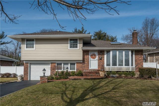 Gas Line Front Of House.Great Mid-Block Location In Renowned Syosset Sd- Updated Split W/Wood Floors & Crown Molding Throughout. Eik With Open Floor Plan To Dining Room W/ Sliders To Outside Deck, Over-Sized Property& Yard, Den W/ Sliders To Outdoor Deck& Patio. Full, Finished Bsmnt. New Siding, New Cac, 5 Years Young Roof, New Appliances, Exterior Lighting And New Fencing!