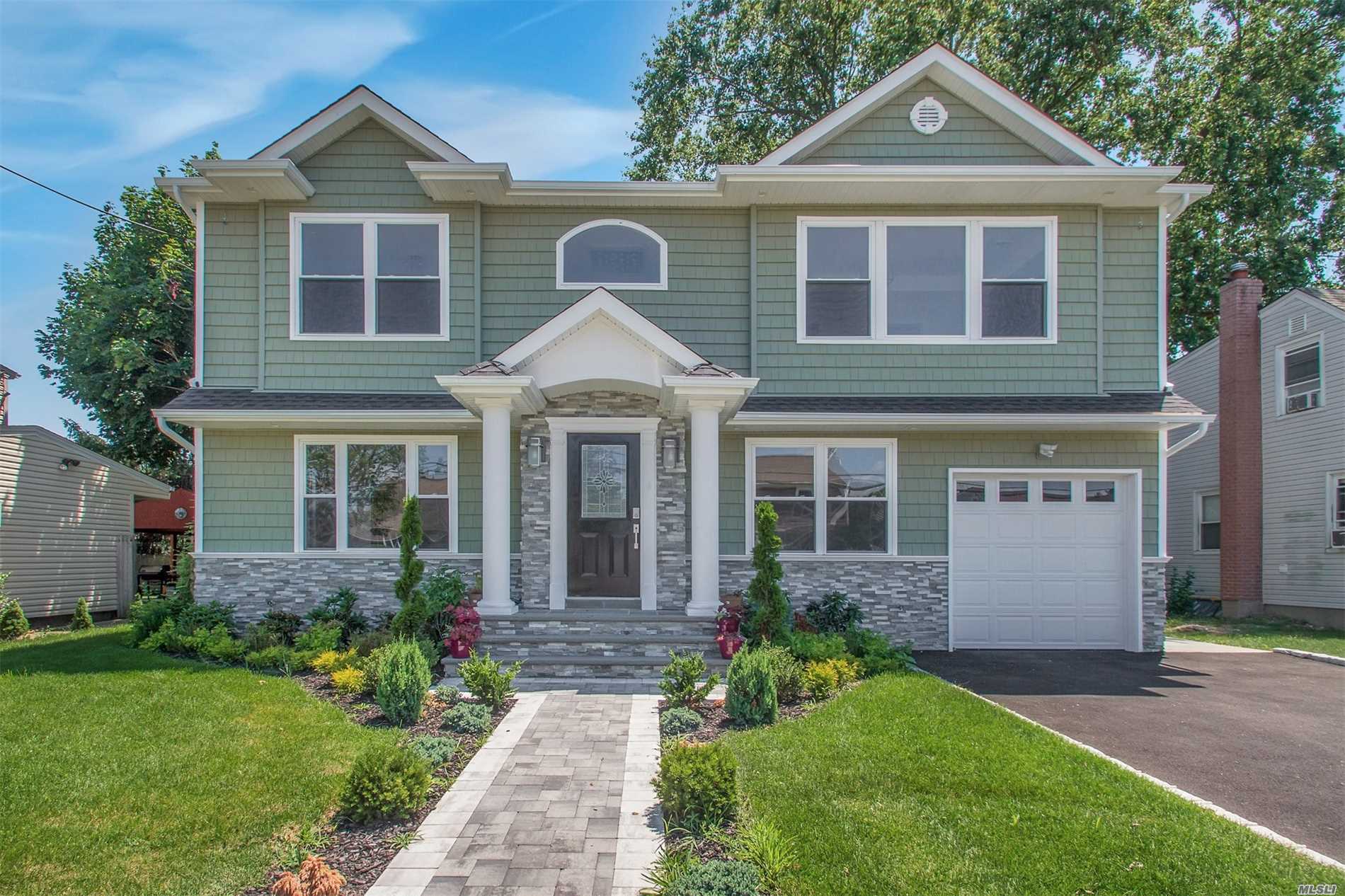 Don&rsquo;t Miss This Stunning Chic Colonial That Has Been Totally Rebuilt And Is In The Desirable Bethpage Sd. This Home Is Anchored By A Great White Quartzite Custom Kitchen W/Center Island & Ss Appliances. Indulge In This Grand Master W/Ensuite & Custom Wic. Attention To Detail Throughout. Fin Basement, Gas, Cac, Cameras, Close To All. (Virtually Staged Photos)