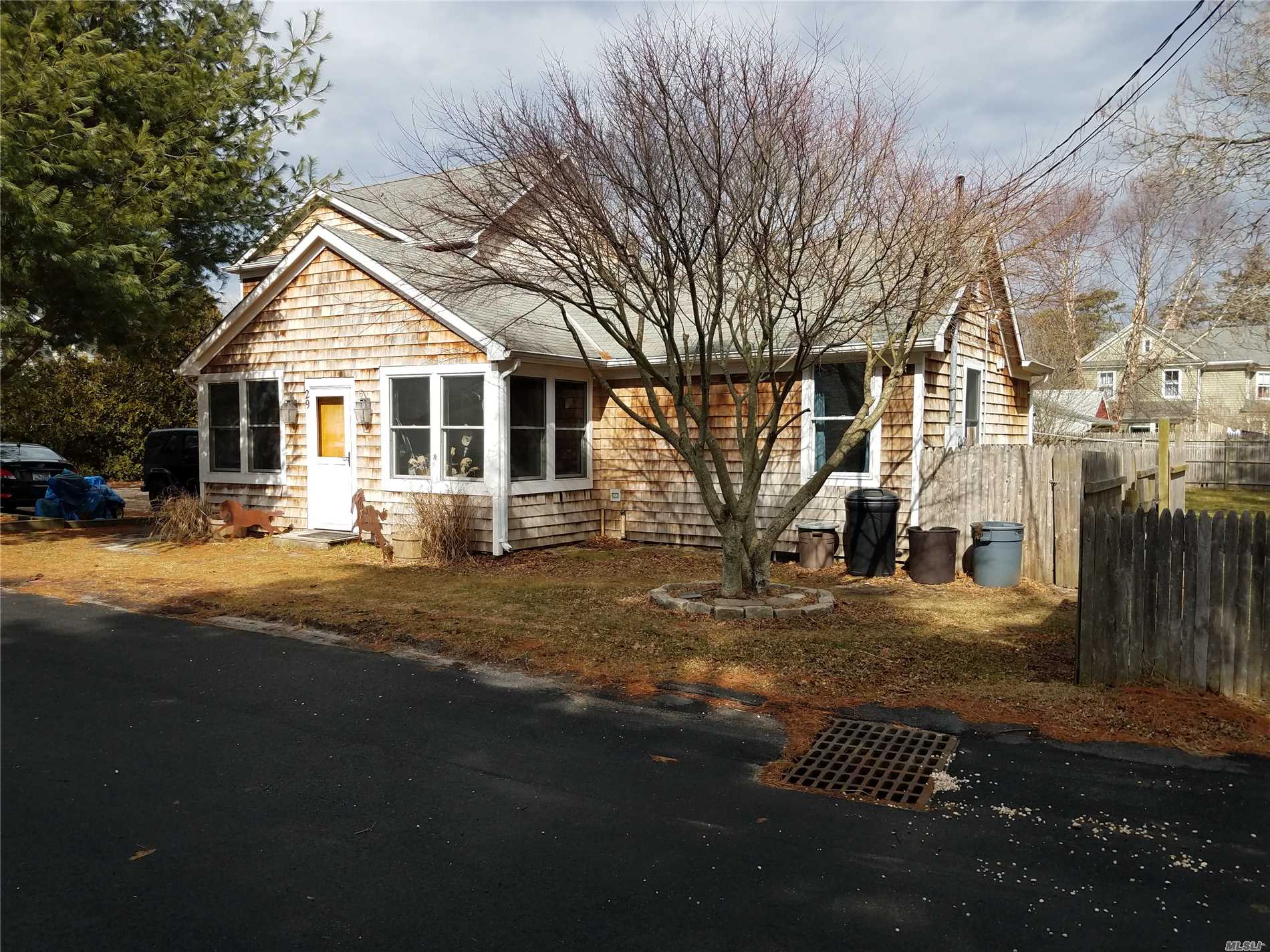 This Cozy East Quogue Home Is On Dead End Street, Conveniently Located Near The Village And Has A Legal Studio Apartment With Kitchen And Full Bath Adjoining The Detached Garage. The Main House Features Enclosed Front Porch, 3 Bedrooms, 2 Full Baths, Living Room W/Fireplace, Kitchen With Dining Area, Additional Living Room With Wood Burning Stove, Large Basement And Very Nice Hot Tub