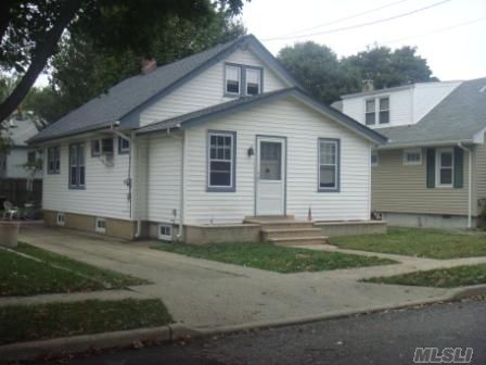 Priced To Sell Immmediately!Walking Distance To Lirr! This Home Features A Completely New Bathroom,New Roof,New Siding,New Windows And The Rest Of The Home Needs Updating.Bring Your Toolbox!There Is A Full Unfinished Basement And A Walk Up Unfinished Attic With Lots Of Potential!Low Taxes And The Taxes Do Not Include The Basic Star Savings Of $797.35