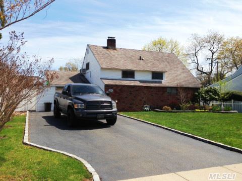 Beautifully Maintained Home W/Manicured Property. Updated Kitchen & Bath, Laminate Flooring, Double-Sided Fireplace, Upgraded Electric Service, Carport W/Storage, 10X13 Vinyl Shed W/Electric, In-Ground Sprinklers, 4 Car Driveway, Possible Mother/Daughter. Quiet Mid-Block Location In Salisbury Section & East Meadow Schools.* Taxes Shown Do Not Include Any Exemptions *