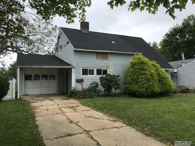 Levitt Ranch, features EIK, Living Room w/Fireplace, 4 Bedrooms, 2 Full Bathrooms, 1 Car Garage, Private Yard. New Roof. Great Opportunity to Remodel to Your Taste. Close to Shopping, Parkways, Schools, LIRR.