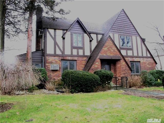 Brick & Stone Tudor. Mint Interiors. Formal Living Room W/ Fireplace, Dr. Updated Eik. Wonderful Glass Enclosed Den. Hardwood Floors. Walk -Up Attic.4 Brs 2.5 Baths, Finished Basement With Wet Bar. 2 Car Attached Garage. Wonderful Backyard Specimen Trees And Plantings. A Place To Call Home!