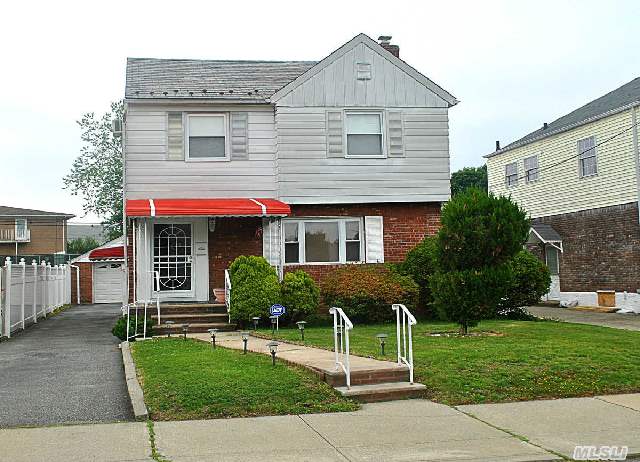 Lovingly Maintained Detached Colonial In Prime Bayside Location. Features Tiled Foyer,  Lr,  Tiled Fdr,  Eik,  3 Spacious Bedrooms,  Vaulted Ceiling In Master Bedroom,  Bath,  Plus A Finished Basement With Full Bath & Summer Kitchen. Gas Heat & Vinyl Windows. Sits On A 40X177 Lot.    P.S. 159 & I.S. 25