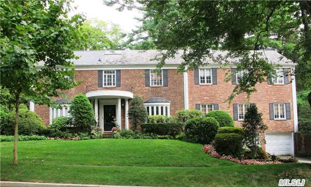 Univ. Gardens Sprawling Brick Center Hall Colonial With Fabulous Curb Appeal. Elegant Living Room Opens To Spacious Great Room. Double French Doors To Patio. Large Marble Bar Area. Large Eik With Breakfast Bar Opens To Family Room. Guest Room & Bath On Main. Wonderful Mexican Terracotta /Hardwood Floors. Skylights. Gas Heat, Central Air. Private Pool & Tennis Courts.