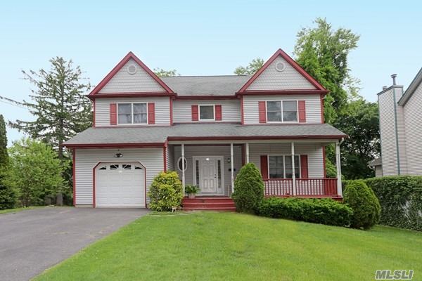 This YOUNG 4 BR/2.5 BTH Colonial is near Huntington & Cold Spring Harbor. The front porch leads to a large Entry Foyer, The EIK has wood Cabs/granite/updated appliances and opens to Den/FPL&Vaulted Ceiling, Formal LR & Dr, entire main level has hardwood floors. The 2nd floor has master BR/tray ceiling & spa bath, 3 addl BRS, full bath and laundry. Full, Fin. basement has high ceilings and plenty of storage. GAS heat & Cooking! Taxes being GRIEVED!!!