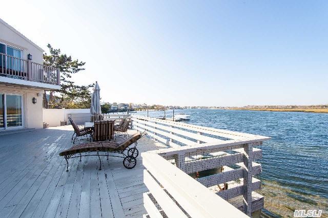 Enjoy Bay Front Living At It's Finest In This Spectacular Colonial On The Open Bay!. Features: Open Layout W/Hw Flooring,  Family Rm W/Fp,  Chef's Kitchen W/Marble Counter Tops & Custom Cabinets,  Mbdr W/ Fb,  W/I Closet & Terrace,  Cac,  Radiant Heat In Full Baths,  Bay Front Deck To Enjoy Amazing Sunsets & Views Of Nyc Skyline. Plans Approved For 62Ft Pier,  Ramp & Boat Lift!