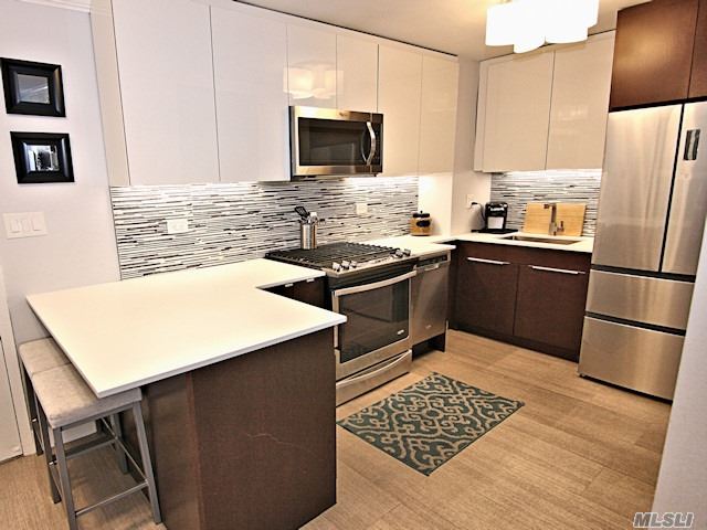 Renovated Open Kitchen, Bath, Living/Din.Room, Bedroom, Spectacular Views Of The Bridges, The Bay & The Manhattan Skyline. 24Hr.Doorman/Security.State Of Art Gym.Shopping Arcade W/ Restaurant/Deli/Grocery Store. Beauty Spa, Pool, Gym & Tennis.Close To All Shopping And Transportation. Total Maint. $1, 133.64 Including Taxes. Garage Xtra