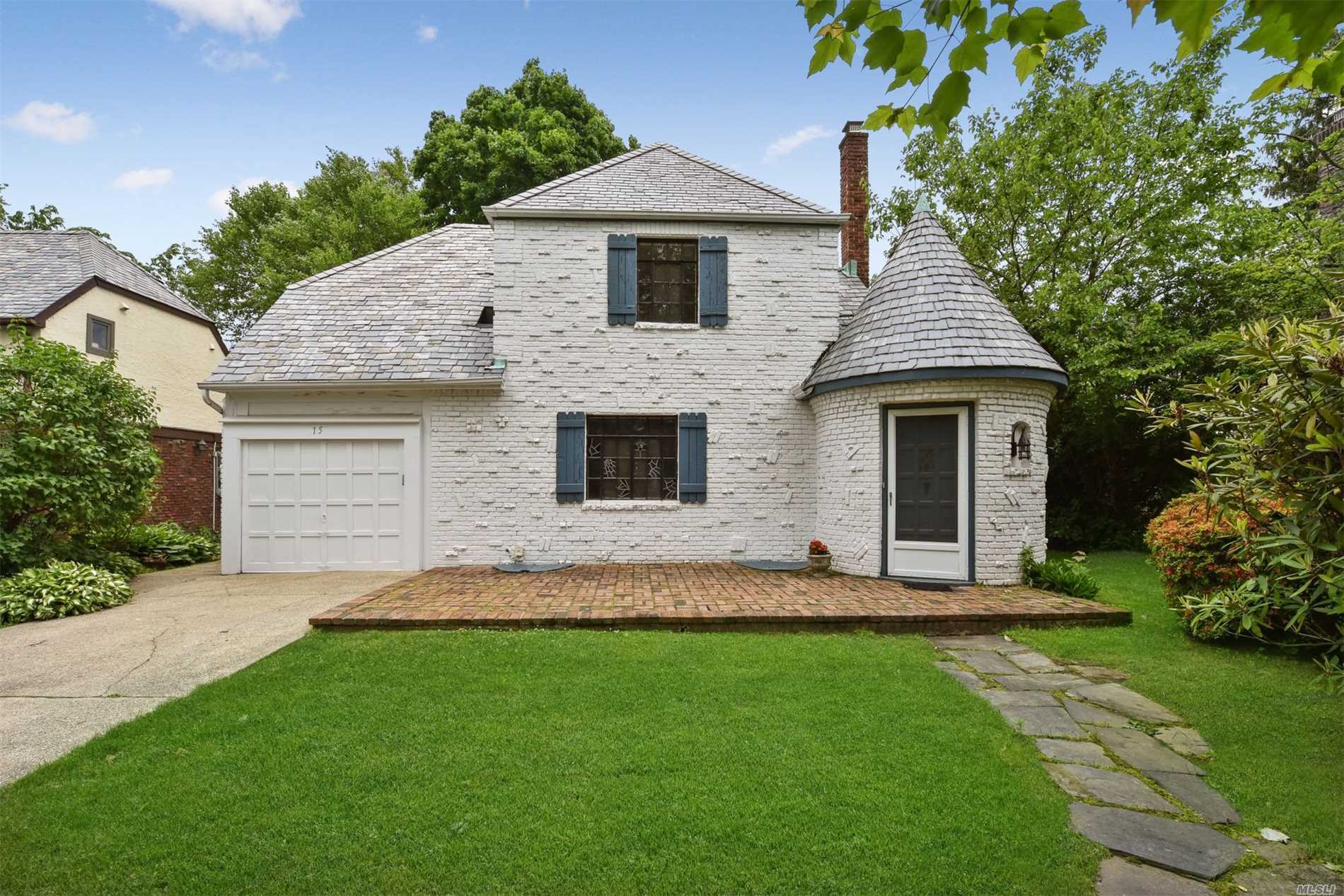 Charming N Strathmore Brick Tudor. Orig Details, Slate Roof, FP, Gleaming redone Wood Floors thru out. Circular Foyer w closet, Lr w Fp, Formal Dr, EIK. 3 Bedrms, 2 Baths, Brick Patios on a Level Lot  Close to all, 4 Blocks to LIRR. Munsey Park School