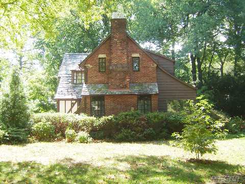 Charming Tudor Located On A Cul De Sac. Wonderful Property.