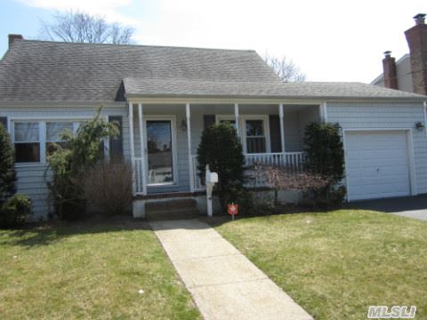 Beautiful Home- A Must See! New Crown Molding, Deck, Fence, Ceramic Tile Tub And Marble Bath, Andersen And Replacement Windows, Newer Roof And Siding, Beautiful Decor, 200 Amp, Inground Sprinklers, Outside Lighting, Multiple Parking Spaces, Custom Closet Organization, Hardwood Floors.