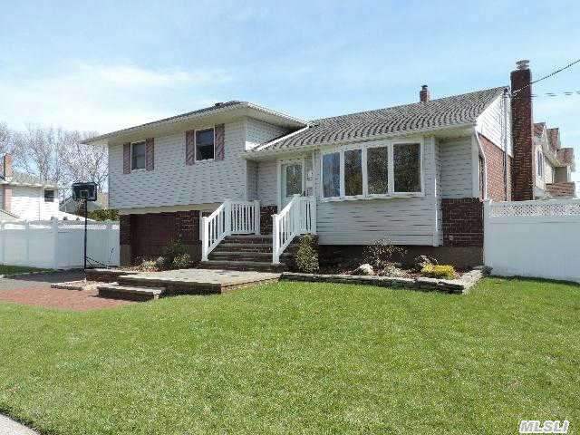 Beautifully Redone Split! New Eat In Kitchen With Marble Counters,  Anderson Windows,  Hardwood Floors,  New Burner With 4 Zones,  200 Amp Electric. Just Move In!!