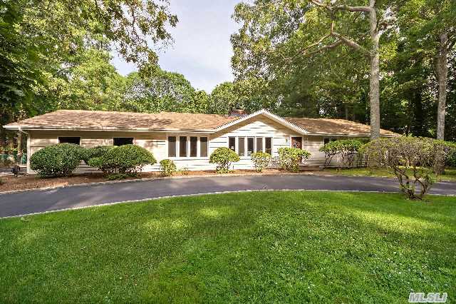 Inviting Classic One Story Residence With Spacious Sunlit Rooms Features Cac,  Oak Floors,  And Double Fireplace.   A True Backyard Retreat Awaits You By The Heated Pool And Patio For Summer Entertaining. All Surrounded By Thoughtful Gardens,  Mature Landscaping And Bordered By 37 Acres Of Preserved Land To Ensure Privacy.