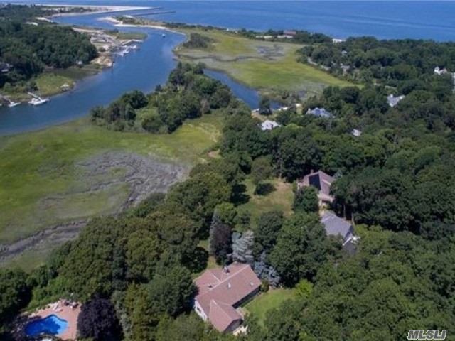 Beautiful Raised Ranch Situated On A Shy Acre With Expansive Decking Overlooking Mattituck Inlet. Formal Entry, Living Room W/ Wood Burning Fireplace, And Eat-In-Kitchen. Two Bedrooms With Jack And Jill Full Bath And Wood Floors Throughout. Downstairs Is Equipped With Den And Is Ready To Be Built Out With Further Bedrooms. Close To A Sandy Long Island Sound Beach.