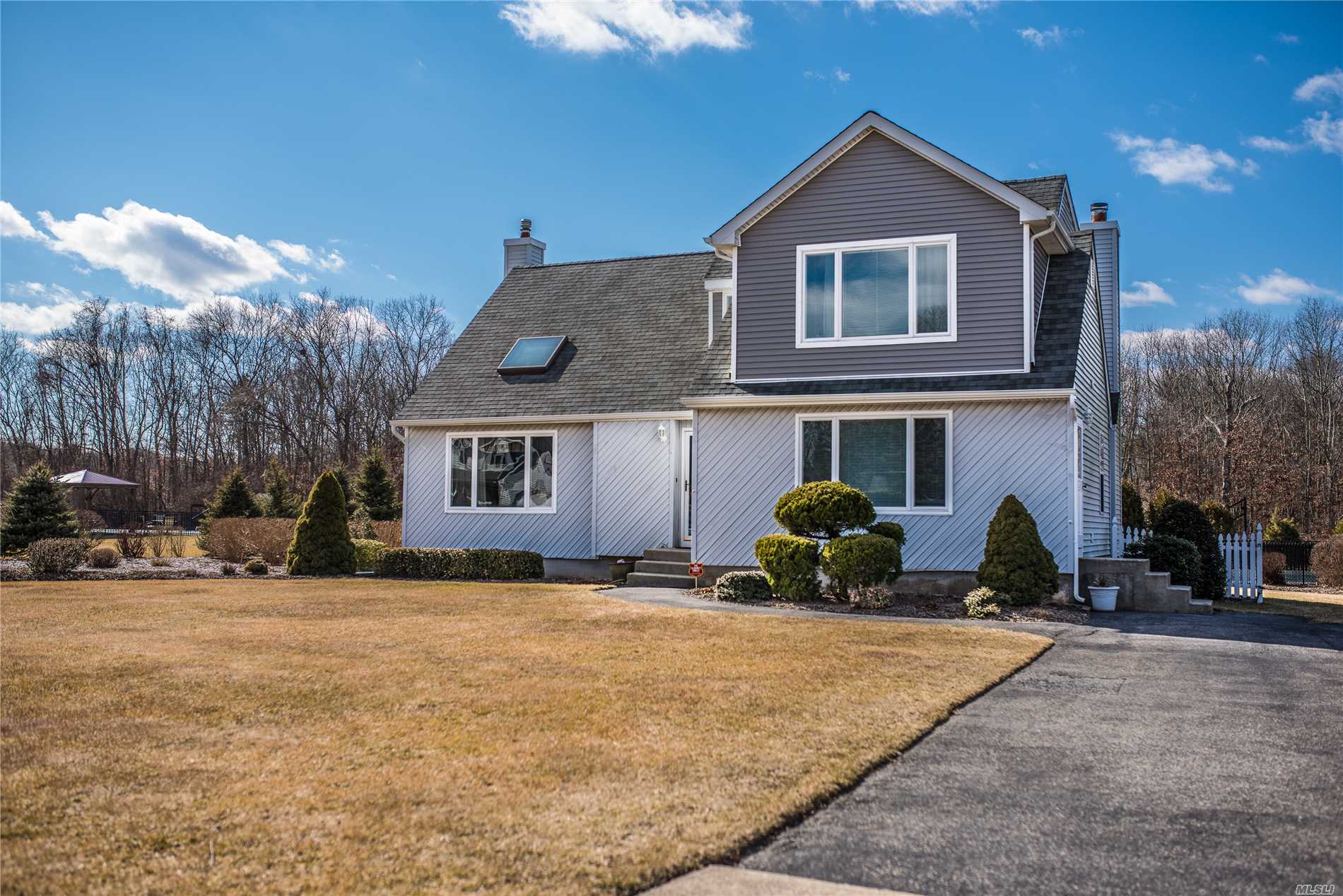 Renovated 4/5 Home On Beautiful Street In Manorville Features: Hardwood Floors, Fam Rm W/Fireplace, Master Bedroom Suite W/Full Bath, 3.5 Bathrooms, Full Finished Basement, New Roof & Hw Heater, Security System, Central Air Conditioning, Large Yard W/In Ground Pool, Basketball Court And In Ground Sprinklers.