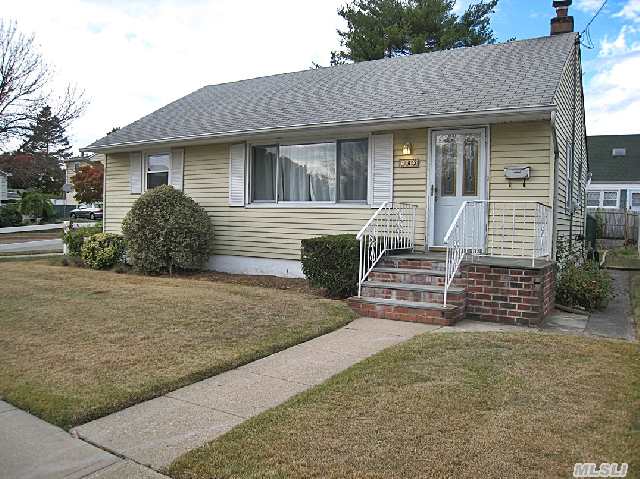 Updated Interior W/ Polished Hardwood Floors; Gleaming Newly Done Kit. Gas Cooking,  New Wood Cabinets/ Granite/ Stainless Steel Appl. Redone Bath W/Tub,  Vanity And Commode; Windows Updated. Large Deck Back Stairs Lead To Bsmt. E-Z Walk To L.I.R.R. Yard Has Storage Shed & Room For Driveway & Garage. Avail. Immediately!!