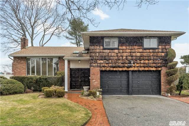 Bright, Wonderful Woodbury Knolls Split In Syosset School District, Over-Sized Rooms, E.I.K., Formal Dining Room, Living Room, Den With Fireplace And Bar, Master Bedroom W/ Bathroom, Skylights Throughout, Central Air, Gas Heat, 2 Car Garage, Close To All, A Must See!! Low Taxes - Only $13, 732.32 With Basic S.T.A.R Reduction