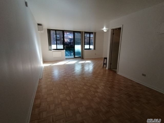 Large studio with Big balcony In the center of flushing. Convenience to All Transportation & Shopping.