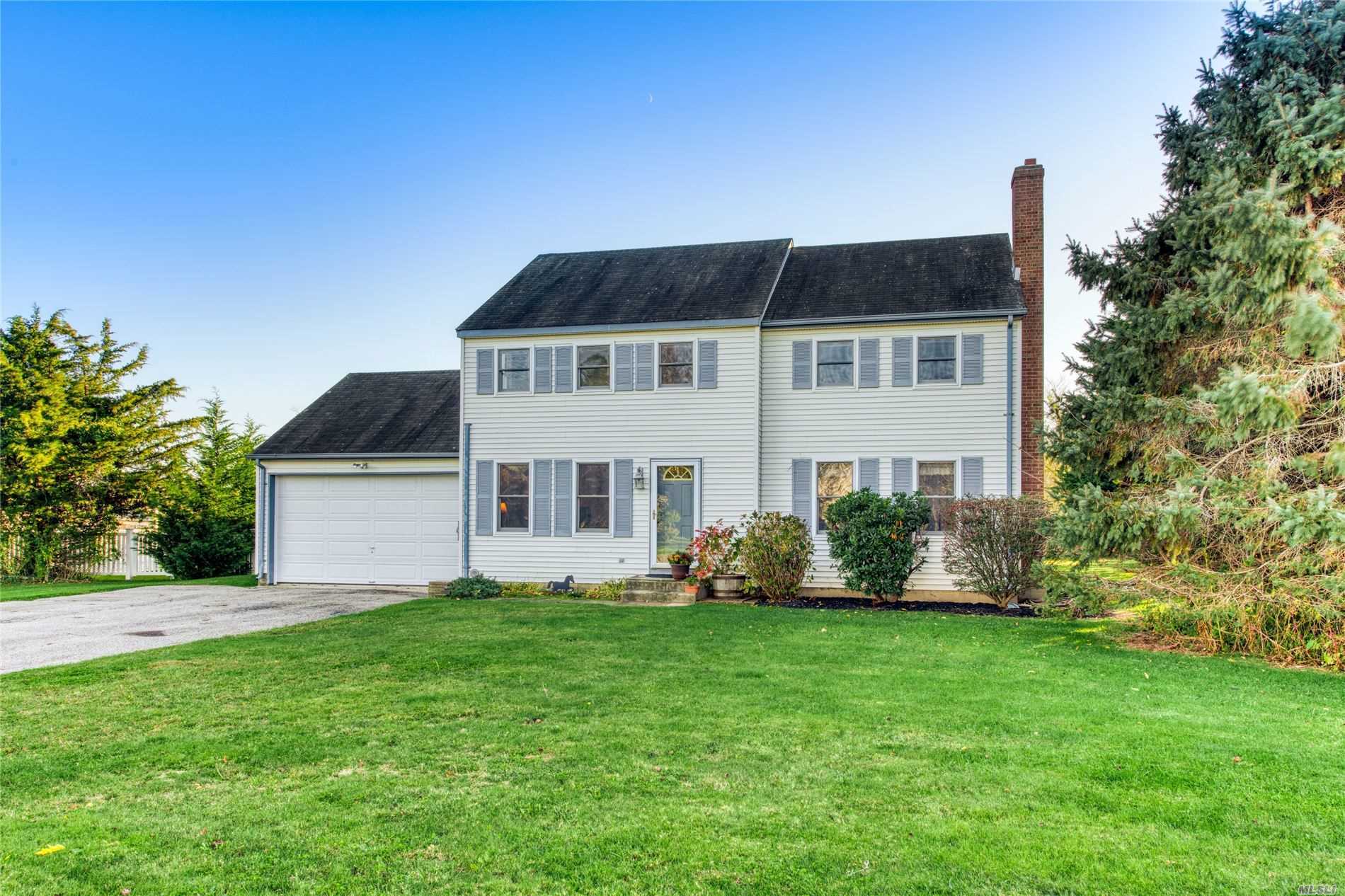 This Expansive North Fork Colonial Home Offers 4 Bedrooms and 3 Full Bathrooms. The home includes a cozy den and a large family room addition. A spacious backyard abutting 22 acres of preserved land awaits. Sleeping arrangements are ample.